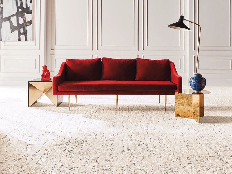 Red sofa on the carpet from Migliore’s Flooring & Rugs in Cookeville, TN